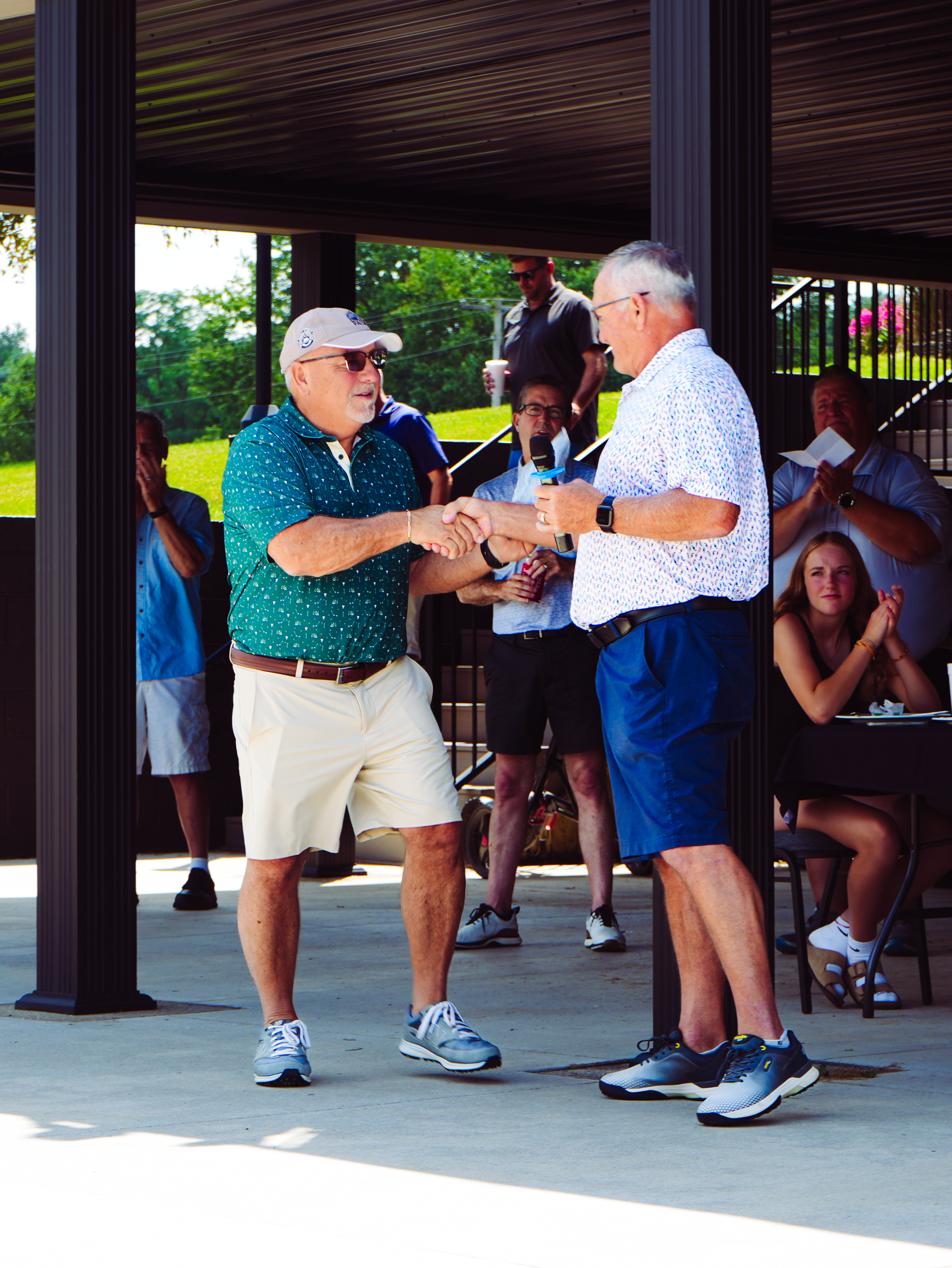 Brad Park, left, presents Jerry Riley, right, with the 2025 Kieth and Janet Swihart Memorial Service Award
